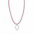 אופק אדלר אואה תכשיטים Santa men's necklace featuring a silver hollow hamsa pendant on a thin red cord.